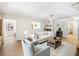 Cozy living room with fireplace, neutral tones, and hardwood flooring at 2466 Thrasher Rd, Buford, GA 30519
