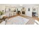 Open concept home with kitchen island, fireplace, and additional living space at 2466 Thrasher Rd, Buford, GA 30519