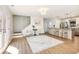 Open floor plan with living room, stairs to the second floor, and kitchen at 2466 Thrasher Rd, Buford, GA 30519