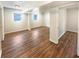 Spacious finished basement with laminate floors and two windows at 4095 Kenora Sw Dr, Atlanta, GA 30331