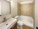 Bathroom features a tiled shower/tub, laminate floors and a modern sink at 4095 Kenora Sw Dr, Atlanta, GA 30331