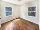 Bedroom with hardwood floors and windows on two walls at 4095 Kenora Sw Dr, Atlanta, GA 30331