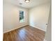 Bedroom with hardwood floors and a window view of the backyard deck at 4095 Kenora Sw Dr, Atlanta, GA 30331