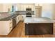 Well-equipped kitchen featuring granite countertops, stainless steel appliances, and a central island at 4095 Kenora Sw Dr, Atlanta, GA 30331