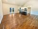 Open-concept living room and kitchen with hardwood floors and vaulted ceilings at 4095 Kenora Sw Dr, Atlanta, GA 30331