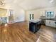 Open-concept kitchen and living room with hardwood floors and vaulted ceilings at 4095 Kenora Sw Dr, Atlanta, GA 30331