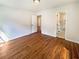 Bright main bedroom with hardwood floors and access to an en-suite bathroom at 4095 Kenora Sw Dr, Atlanta, GA 30331