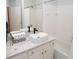 Bright bathroom with a modern vessel sink, white tiled shower and tub, and clean finishes at 821 Ralph Mcgill Ne Blvd # 3209, Atlanta, GA 30306