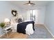 Serene bedroom featuring a plush bed, contemporary artwork, and hardwood floors, bathed in natural light from a nearby window at 821 Ralph Mcgill Ne Blvd # 3209, Atlanta, GA 30306