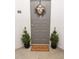 Welcoming gray front door is nicely decorated with a wreath and potted topiaries at 821 Ralph Mcgill Ne Blvd # 3209, Atlanta, GA 30306