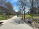 Paved pathway through lush greenery, with scooter parking nearby, providing a scenic route for walking and recreation at 821 Ralph Mcgill Ne Blvd # 3209, Atlanta, GA 30306