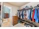 Large walk-in closet includes shelving for clothing and shoes at 1168 Blackhawk Pl, Lawrenceville, GA 30043