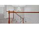 Bright foyer showcasing wood railing and staircase leading to the front door at 1236 Nottoway Trl, Marietta, GA 30066