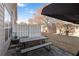 Backyard with a patio featuring an outdoor table and privacy fence with a shade tree at 156 Haven Oak Way, Lawrenceville, GA 30044