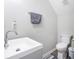 Bathroom features a modern sink and toilet and grey color scheme at 156 Haven Oak Way, Lawrenceville, GA 30044