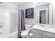 Bathroom features a tub, toilet, and vanity with granite countertops and built-in storage at 156 Haven Oak Way, Lawrenceville, GA 30044