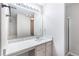 Bathroom featuring white cabinets, vanity with countertop and a shower at 156 Haven Oak Way, Lawrenceville, GA 30044