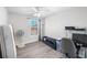 Bedroom has a ceiling fan, bright windows, and light grey updated flooring at 156 Haven Oak Way, Lawrenceville, GA 30044