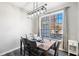 Cozy dining area with a contemporary light fixture and large window at 156 Haven Oak Way, Lawrenceville, GA 30044