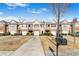 Attractive townhome exteriors with landscaped front yards and attached garages at 156 Haven Oak Way, Lawrenceville, GA 30044