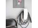 Garage featuring a gray electrical panel and a mounted Tesla charging station at 156 Haven Oak Way, Lawrenceville, GA 30044