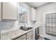 Modern kitchen with stainless steel appliances and granite countertops at 156 Haven Oak Way, Lawrenceville, GA 30044
