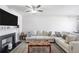 Comfortable living room with modern fireplace and neutral color scheme at 156 Haven Oak Way, Lawrenceville, GA 30044