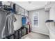 Walk-in closet with a window and shelving featuring clothing and luggage at 156 Haven Oak Way, Lawrenceville, GA 30044