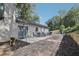 Charming backyard with a stone patio, ample seating, a grill, and a retaining wall at 2418 Bolling Brook Sw Dr, Atlanta, GA 30311