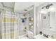 Updated bathroom with tiled shower and tub featuring modern fixtures at 2418 Bolling Brook Sw Dr, Atlanta, GA 30311