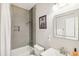 Modern bathroom features a shower-tub combo and sleek fixtures at 2418 Bolling Brook Sw Dr, Atlanta, GA 30311