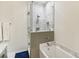 Modern bathroom featuring a glass shower with marble tile surround and a deep soaking tub at 2418 Bolling Brook Sw Dr, Atlanta, GA 30311