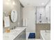 Elegant bathroom with marble countertops, double sinks, and a glass-enclosed shower and tub combo at 2418 Bolling Brook Sw Dr, Atlanta, GA 30311