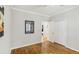 Bedroom with hardwood floors, closet, and bright natural light at 2418 Bolling Brook Sw Dr, Atlanta, GA 30311