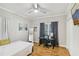 Comfortable bedroom offers natural light with a desk and soft accents at 2418 Bolling Brook Sw Dr, Atlanta, GA 30311