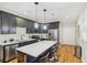 Stylish kitchen featuring sleek cabinetry, stainless steel appliances, and a center island with quartz countertop and seating at 2418 Bolling Brook Sw Dr, Atlanta, GA 30311