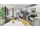 Cozy basement kitchen with stainless steel appliances, and a view into the living room at 2418 Bolling Brook Sw Dr, Atlanta, GA 30311