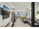 Open-concept living room with modern decor, recessed lighting, and hardwood floors provides a comfortable space at 2418 Bolling Brook Sw Dr, Atlanta, GA 30311