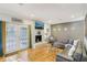 Cozy living room with hardwood floors, white brick fireplace, and modern furnishings, ideal for relaxation at 2418 Bolling Brook Sw Dr, Atlanta, GA 30311