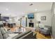 Bright and airy living room with hardwood floors, brick fireplace, and a glimpse of the adjacent kitchen at 2418 Bolling Brook Sw Dr, Atlanta, GA 30311