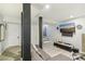 Cozy basement living room with neutral-toned furniture and dark wood pillar accents at 2418 Bolling Brook Sw Dr, Atlanta, GA 30311