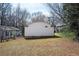 Spacious backyard with a home featuring vinyl siding and a small window under the roofline at 3162 Alston Dr, Decatur, GA 30032