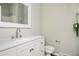 Bathroom with white cabinets, a large mirror, modern faucet, and tiled shower at 3162 Alston Dr, Decatur, GA 30032