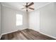 Bedroom features hardwood flooring, neutral paint, closet, and a window for natural light at 3162 Alston Dr, Decatur, GA 30032