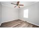 Bedroom features hardwood flooring, neutral paint, and a window for natural light at 3162 Alston Dr, Decatur, GA 30032