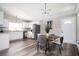 Modern kitchen with granite countertops, white cabinetry and stainless steel appliances open to dining area at 3162 Alston Dr, Decatur, GA 30032