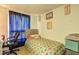 Cozy bedroom featuring neutral walls, colorful bedding, and a comfortable workspace area at 3576 Shrewsbury Ct, Snellville, GA 30039