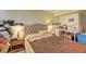 Spacious bedroom with a large bed, bright natural light, and ample storage and workspace at 3576 Shrewsbury Ct, Snellville, GA 30039