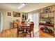 Charming dining room features wood floors, natural light, and a breakfast nook at 3576 Shrewsbury Ct, Snellville, GA 30039