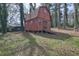 Exterior view of a shed on the lot with a rustic barn design and a wooden ramp at 3576 Shrewsbury Ct, Snellville, GA 30039